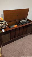 Full view of RCA Victor Custom Series 811 stereo console with lid open, showing turntable and control panel inside.