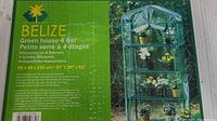 Box label showing product name Belize Green house 4 tier with dimensions and material details