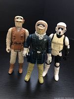 Three vintage Star Wars figures: Han Solo Hoth in brown vest, Hoth Rebel Trooper in navy jacket and beige hood, plus white-armored Biker Scout.