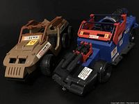 Two vintage GI Joe vehicles shown side by side on a black background. Left vehicle is tan Desert Fox with six wheels; right vehicle is blue and red Dreadnok Thunder Machine with mounted cannon.