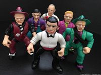 Front angle photo showing all six Dick Tracy Playmates action figures posed in a group on a black background.