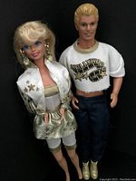 Both 1992 Hollywood Barbie and Ken dolls posed side by side, showing full body and outfit details on black background