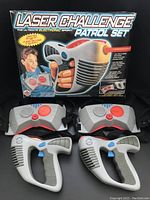 Laser Challenge Patrol Set box with 2 laser guns and 2 sensor vests displayed in front, showing overall contents and packaging.