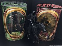 Two sealed Lord of the Rings figures in original packaging (Frodo and Faramir) and one loose Ringwraith on horse figure.
