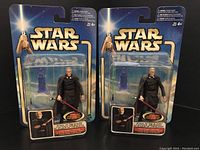 Photo of two sealed Star Wars Count Dooku action figures in original 2002 Attack Of The Clones packaging.