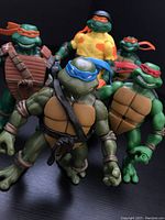 Five 2003 Playmates Teenage Mutant Ninja Turtles action figures displayed in front view, showing colors, masks, and accessories.