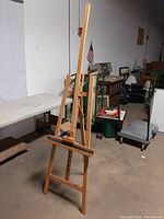 Front and side views of the adjustable beechwood easel stand showing its structure, materials, and adjustable mechanism.