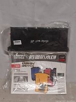 Photo of Osah Drypak factory sealed in original packaging, showing multiple color options and size 18L on packaging.