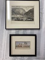 Two framed prints: one black and white Delaware Water Gap landscape print and one smaller colored Monticello architectural print, both with black frames and cream mats.