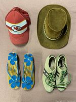 Photo showing all four items: KC Chiefs hat, leather Australian hat, wooden sandals, and suede running shoes.