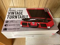 Box of the portable 3-speed vintage turntable with image and features