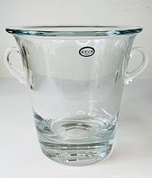 Front view of vintage heavy lead crystal champagne bucket showing two side handles and original Abbott Poland label.