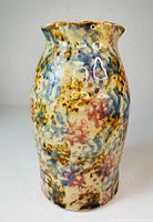 Full front view of spatterware vase showing multicolor glaze and glossy finish.
