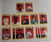 Photo showing 14 baseball cards from 1988 Topps All Stars AL Leaders series with images of players on front.