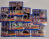 Photo showing 18 baseball cards from the 1991 Donruss All Stars series featuring players Wade Boggs, Rickey Henderson, Cal Ripken, Sandy Alomar, Steve Sax, Jose Canseco, Ken Griffey Jr., Bob Welch, and Mark McGwire.