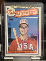Front of the 1984 Topps USA Baseball Team Mark McGwire rookie card showing player photo, name, position, and card branding.