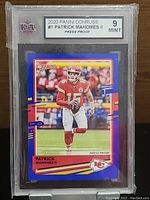 Front of 2020 Panini Donruss Patrick Mahomes II Press Proof graded card showing player in action, grade Mint 9.