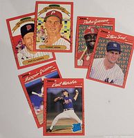 Photo showing six Donruss baseball cards arranged on white background, including 1989 Diamond Kings Dan Gladden and Tommy Herr, 1990 MVP Pedro Guerrero and Steve Sax, 1990 Rated Rookie Marquis Grissom and Kent Merker.