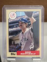 Front side of Don Mattingly New York Yankees baseball card with player photo and Topps logo.
