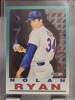 Front side of 1992 Fleer Nolan Ryan art baseball card showing player in Texas Rangers uniform with tally marks in background.