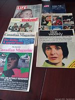 Collection of vintage magazines from 1967-1971 including Life magazine, Titanic book, Canadian Magazine issues, Star Weekly, and Weekend magazine.