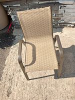 Top view of one vinyl toddler outdoor chair showing seat and armrests