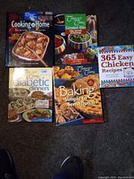 Photo showing all 5 cookbooks in the lot arranged closely with visible titles and cover images.