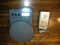 Gray Pelouze digital kitchen scale with round platform and LCD display showing zeroed status.