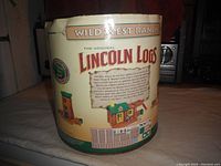Cylindrical container packaging with Wild West Ranch branding and Lincoln Logs logo