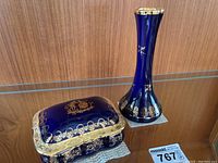 Photo of cobalt blue vase and square trinket box side by side showing design and size relation