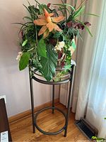 Full view of the plant stand with planter and faux plant displayed inside. Shows condition and scale of items together.