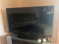Front view of the Philips 40" LED TV showing the screen and Philips logo on the bezel.