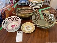 Overview of the lot showing four bowls and a plate, with price tag indicating "China" and need for cleaning.