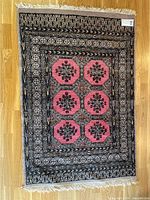 Full view of the hand pulled rug showing geometric pattern and overall condition