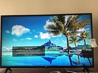Front view showing screen with ‘No Signal’ message and landscape background