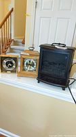 Full view of two clocks and electric heater side by side on shelf showing shape, design, and condition