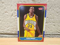 Front of Kevin Durant rookie card showing him in Seattle Sonics yellow jersey number 35 with Fleer logo.