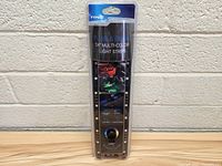 Front view photo of packaged Plug & Glow 24 inch multi-color light strip for cars, showing black strip with LEDs and control buttons.