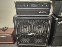 Full view of Carvin amplifier head stacked on 4x12 speaker cabinet