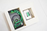 Harman EZ-35 reusable 35mm film camera with attached green strap and Kodak Kodacolor 200 35mm film cartridge inside box