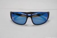 Front view of the Bolle sunglasses showing the black plastic frame and reflective blue lenses.