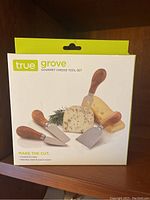 True Grove Gourmet Cheese Tool Set box showing 3 knives and 1 fork with acacia wood handles
