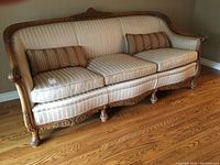 Front angle view of the entire sofa showing frame, cushions, and pillows