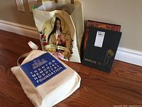 Multiple Trenton High School yearbooks displayed on floor, some in bags, including identifiable covers.