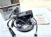 Full kit showing the Black & Decker Rotary Hobby Shop tool, flexible shaft, revolving carousel accessory holder, power cord, instructions, and original box.