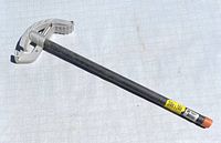 Photo showing the Greenlee 840A conduit bender with its full length and aluminum bending shoe, plastic end cap, and yellow labels.