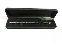 Full view of the Italian sterling silver bracelet inside a black velvet-lined box showing clasp and chain design.