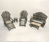 Full set of wooden doll furniture with Adirondack chairs, foot rests, bench, and two tables in rustic distressed finish.