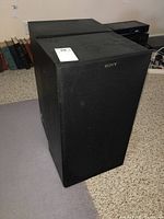 Sony SS-C47 speaker system with black fabric grille front and silver Sony logo.