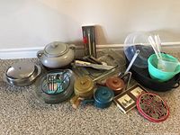 Overview of all items including bean pot, Pyrex dishes, roasting pan, bowls, coasters, and utensils